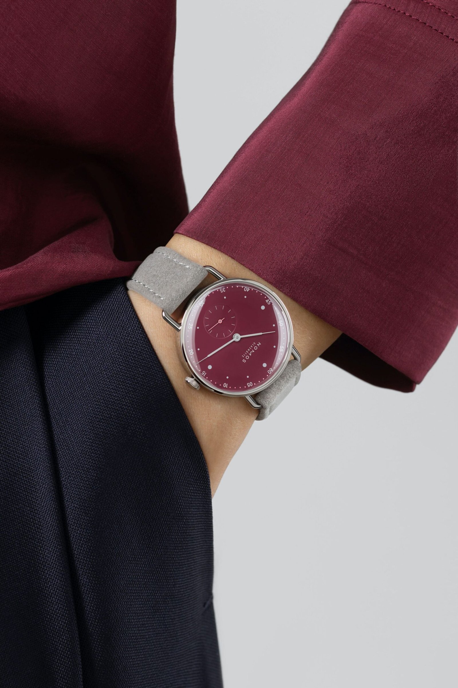 Nomos-Glashutte-Metro-33-Muted-Red-Wrist-Shots-2-scaled.jpg