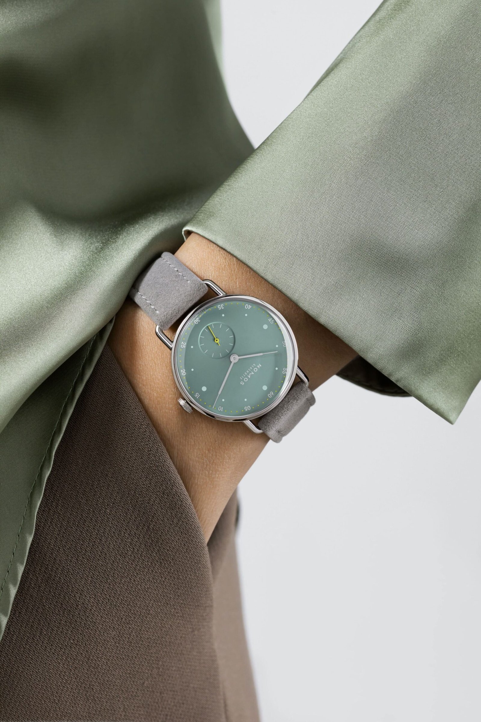 Nomos-Glashutte-Metro-33-Sage-Wrist-Shots-scaled.jpg